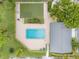 Community pool with putting green and surrounding landscaping at 2465 Northside Dr # 701, Clearwater, FL 33761