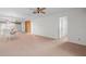 Living room with carpet, mirror wall, and access to other rooms at 2465 Northside Dr # 701, Clearwater, FL 33761