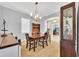 Formal dining room with a wood table, hutch, and view to office at 8703 Alafia Hills Dr, Plant City, FL 33567