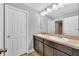 Double vanity bathroom with dark wood cabinets at 8703 Alafia Hills Dr, Plant City, FL 33567