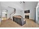 Spacious living room with fireplace and view of kitchen at 8703 Alafia Hills Dr, Plant City, FL 33567
