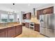 Modern kitchen with double sink and breakfast bar at 8703 Alafia Hills Dr, Plant City, FL 33567