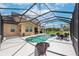 Inviting pool and spa with a screened-in enclosure at 8703 Alafia Hills Dr, Plant City, FL 33567