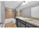 Bathroom with a shower/tub combo and dark vanity at 8703 Alafia Hills Dr, Plant City, FL 33567