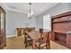 Elegant dining room with wood table and hutch at 8703 Alafia Hills Dr, Plant City, FL 33567