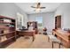 Home office with built-in shelving and a large desk at 8703 Alafia Hills Dr, Plant City, FL 33567
