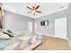 Spacious bedroom with carpet flooring and ceiling fan at 8703 Alafia Hills Dr, Plant City, FL 33567