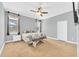 Large main bedroom with ceiling fan and carpet at 8703 Alafia Hills Dr, Plant City, FL 33567