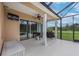 Covered lanai with outdoor grill and view of the pasture at 8703 Alafia Hills Dr, Plant City, FL 33567