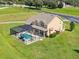 Two-story house with screened-in pool and large backyard at 8703 Alafia Hills Dr, Plant City, FL 33567