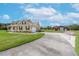 Two-story house with attached garage and long driveway at 8703 Alafia Hills Dr, Plant City, FL 33567