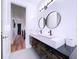 Contemporary bathroom featuring a double vanity and dark wood cabinets at 6564 Simone Shores Cir, Apollo Beach, FL 33572