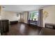 Living room features dark hardwood floors and neutral colored walls at 3615 Latimer St, New Port Richey, FL 34652