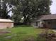 Large backyard with detached garage at 15704 Almondwood Dr, Tampa, FL 33613