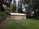 View of a detached garage in the backyard at 15704 Almondwood Dr, Tampa, FL 33613