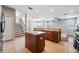 Open kitchen with large island, stainless steel appliances, and wood cabinets at 20270 Merry Oak Ave, Tampa, FL 33647
