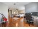 Main bedroom with wood floors, ceiling fan, and built-in workspace at 20270 Merry Oak Ave, Tampa, FL 33647