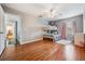 Bedroom with wood floors, ceiling fan, and access to bathroom at 20270 Merry Oak Ave, Tampa, FL 33647