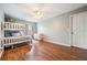 Bedroom with wood floors, ceiling fan, and bunk bed at 20270 Merry Oak Ave, Tampa, FL 33647