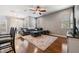 Spacious living room with hardwood floors, a sectional sofa and large TV at 20270 Merry Oak Ave, Tampa, FL 33647