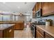 Open kitchen with stainless steel appliances and an island at 20270 Merry Oak Ave, Tampa, FL 33647