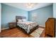 Bedroom with wood floors, ceiling fan, and window coverings at 20270 Merry Oak Ave, Tampa, FL 33647