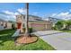 Two-story house with solar panels and a two-car garage at 20270 Merry Oak Ave, Tampa, FL 33647