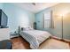 Bright bedroom with wood floors and window coverings at 20270 Merry Oak Ave, Tampa, FL 33647