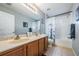 Bathroom with double vanity and shower/tub combo at 20270 Merry Oak Ave, Tampa, FL 33647