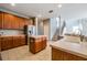 Eat-in kitchen with island, stainless steel appliances, and wood cabinets at 20270 Merry Oak Ave, Tampa, FL 33647