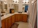 Primary bathroom with double sinks and updated cabinetry at 197 Philadelphia Blvd # 26, Palm Harbor, FL 34684
