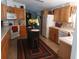 Well-equipped kitchen with light wood cabinets, an island, and modern appliances at 197 Philadelphia Blvd # 26, Palm Harbor, FL 34684
