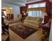 Relaxing living room with comfortable seating and a view to the dining area at 197 Philadelphia Blvd # 26, Palm Harbor, FL 34684