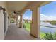 Balcony with columns overlooking a lake, fountain and manicured landscaping at 43 Bayview S Ct # A, St Petersburg, FL 33711