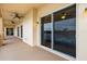 Covered balcony featuring ceiling fans, elegant lighting fixtures, and seamless access to indoor spaces at 43 Bayview S Ct # A, St Petersburg, FL 33711
