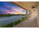 Enjoy colorful sunsets over the lake from this spacious balcony with glass railings and ceiling fans at 43 Bayview S Ct # A, St Petersburg, FL 33711