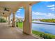Expansive balcony offering stunning views of the lake, lush landscaping, and nearby residences at 43 Bayview S Ct # A, St Petersburg, FL 33711