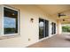 Long balcony featuring sliding glass doors, ceiling fans, and beautiful views of the surrounding landscape at 43 Bayview S Ct # A, St Petersburg, FL 33711