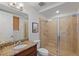Bathroom featuring a vanity with granite countertop and framed glass shower at 43 Bayview S Ct # A, St Petersburg, FL 33711