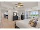 Spacious bedroom with waterfront view, furniture, and seating area at 43 Bayview S Ct # A, St Petersburg, FL 33711