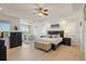 Bright bedroom with seating area, tray ceiling, and wood-look floors at 43 Bayview S Ct # A, St Petersburg, FL 33711