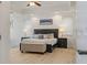 Bright bedroom with a large bed, tray ceiling, and wood-look floors at 43 Bayview S Ct # A, St Petersburg, FL 33711