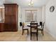 Cozy dining area features a wooden table, seating for four, and natural light from the window at 43 Bayview S Ct # A, St Petersburg, FL 33711