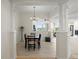 Elegant dining room with decorative columns, chandelier, and views into the adjacent living space at 43 Bayview S Ct # A, St Petersburg, FL 33711