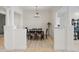 Open-concept dining room featuring stylish columns, hardwood floors, and a modern chandelier at 43 Bayview S Ct # A, St Petersburg, FL 33711