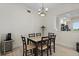Bright dining room with a modern table, hardwood floors, and a sleek wine refrigerator at 43 Bayview S Ct # A, St Petersburg, FL 33711