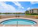 Enjoy the community hot tub with a view of the lake and lush landscaping at 43 Bayview S Ct # A, St Petersburg, FL 33711
