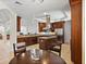 Open kitchen with stainless steel appliances, granite countertops, wood cabinetry, and a central island at 43 Bayview S Ct # A, St Petersburg, FL 33711
