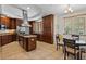 Beautiful kitchen features stainless steel appliances, a central island, granite countertops, and wood cabinets at 43 Bayview S Ct # A, St Petersburg, FL 33711