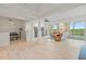 Bright, open living space with hardwood floors, recessed lighting, a ceiling fan, and sliding doors to a balcony at 43 Bayview S Ct # A, St Petersburg, FL 33711